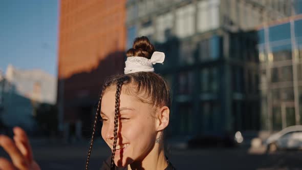 Young Woman Expresses Feelings Through Energetic Dance Moves alt