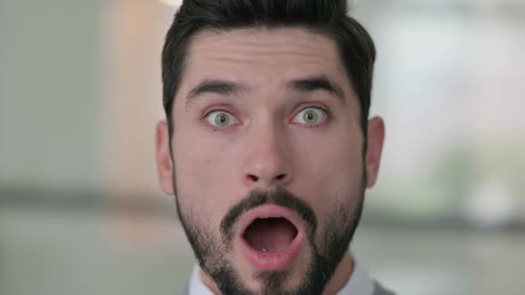 Close Up of Young Man with Shocked Expression alt