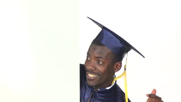 Graduate Pointing To the White Card. White. Slow Motion. Close Up alt