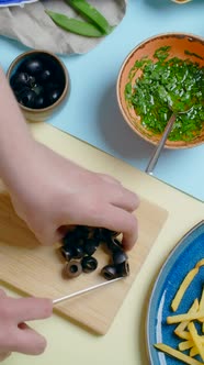 Vertical Flat Lay Video Chef Cuts the Olives Tabletop Recipes