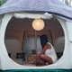 Pretty Woman Sitting Inside the Luxury Tent House and Working on Her Laptop - VideoHive Item for Sale