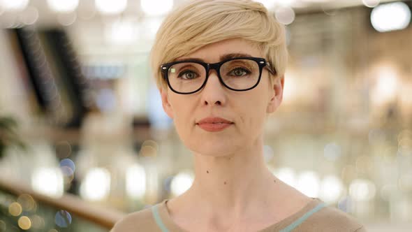 Closeup Middleaged Adult Lady in Glasses Looking at Camera Poor Vision Problems with Eyesight alt