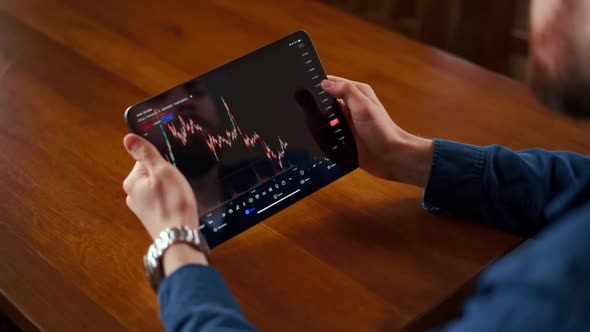 Businessman checking bitcoin price chart on digital exchange on mobile phone screen, cryptocurrency alt