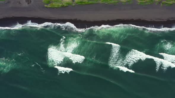 Aerial Top View of Beach with Black Sand