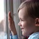 Happy Little Boy Waving His Hand and Smile in Window - VideoHive Item for Sale