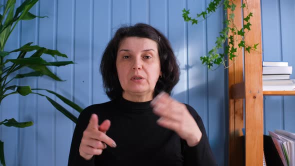 Woman Sit at Desk and Talk with Teacher Study Online Use Video Conference Application alt