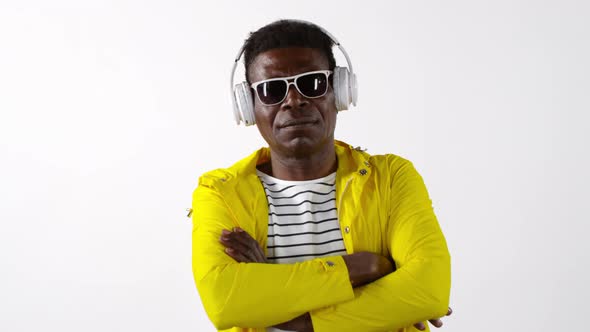 Portrait of Hipster Black Man in Headphones and Sunglasses alt