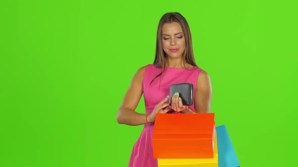 Woman with Credit Card and Shopping Bags, Green Screen alt