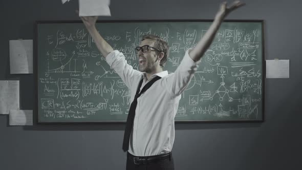 Cheerful mathematician solving a problem and celebrating