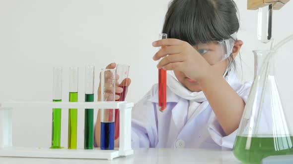 Children play and learn chemical in laboratory