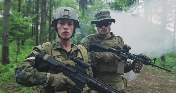 Squad of Soldiers Patrolling Across the Forest Area Team with Male and Female Soliders in Dense alt