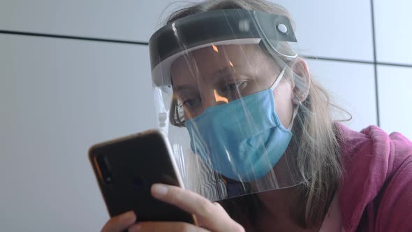 Adult Woman in Medical Mask and Face Shield in Airport