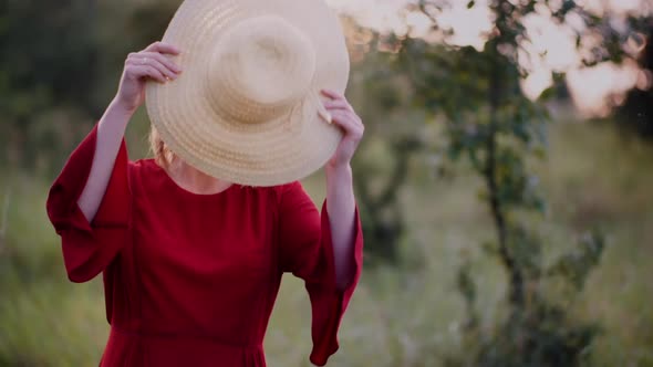 Portrait of Positive Smiling Woman Looking Into Camera at Sunset alt
