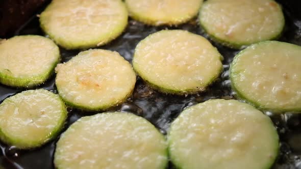 Cooking Zucchini Slices in a Pan Fried Vegetables alt