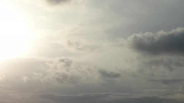 Timelapse of an aircraft followed by dark stormy clouds while night comes. alt