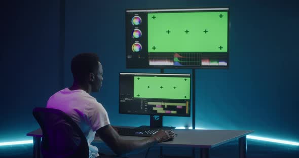 Video Editor at Work in Editing Room alt