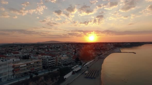 Aerial Scene of Coastal Resort Town at Sunrise. Nea Kallikratia, Greece alt