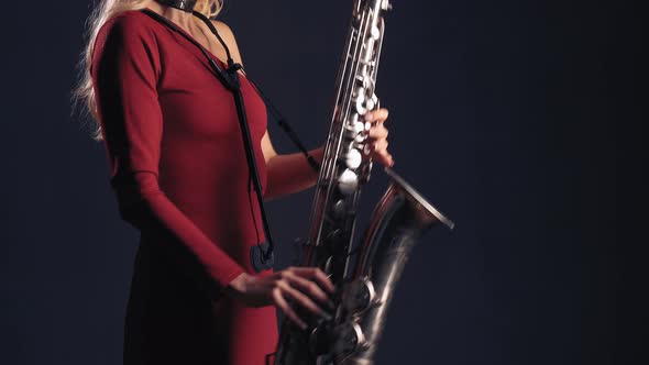 Woman Plays On Saxophone Jazz Melody