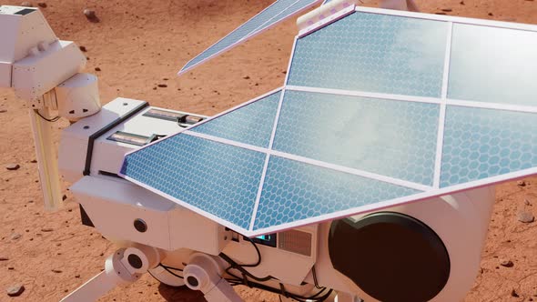 Planetary rover charging batteries. The solar power robot having a break. alt