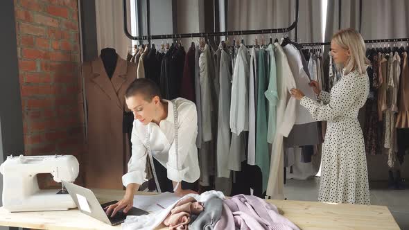 Attractive Female Tailor Look at Laptop alt