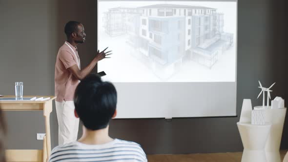 African American Man Presenting Architectural Project on Conference alt