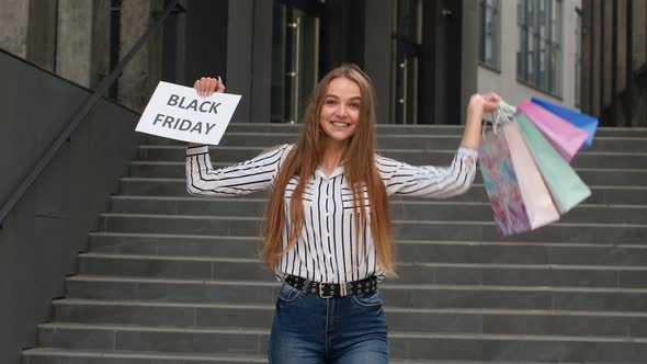 Joyful Teen Girl Showing Black Friday Inscription, Smiling, Looking Satisfied with Low Prices alt