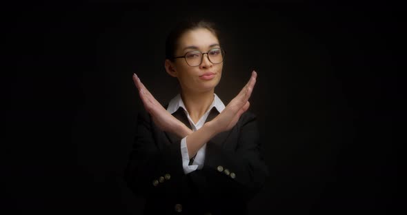 Serious Woman in Business Style Crossed Her Arms in X Sign and Saying No alt