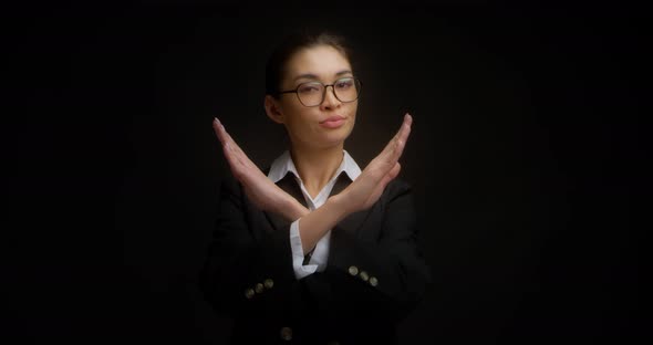 Serious Woman in Business Style Crossed Her Arms in X Sign and Saying No