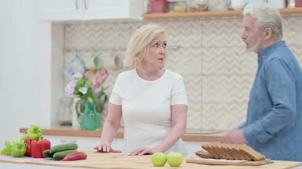 Loving Old Woman Arguing with Old Man in Kitchen alt