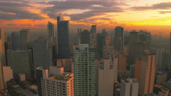 Sunrise in a Downtown View From High Above with Multiple Skyscrapers in Manila City, Philippines alt