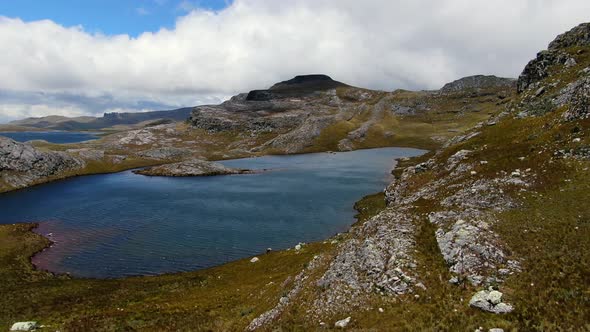 Stunning Landscape At Lagunas de Alto Peru Against Cloudscape In Cajamarca Peru. Aerial Drone alt