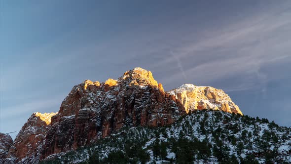 Time lapse of snow covered mountain top in Zion at sunset alt