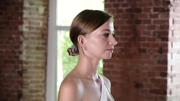 Closeup Portrait of Young Caucasian Woman Holding Hands in Namaste Sign at Gym alt