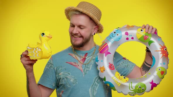 Traveler Tourist Adult Man Dancing Fooling with Swimming Ring and Duck Toy Travel on Weekends alt