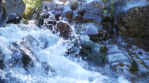 Small Rapids With Fast Moving Water Running Beside Rocks 2 alt