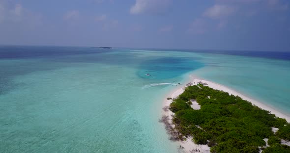 Daytime drone abstract shot of a white sand paradise beach and aqua blue ocean background in vibrant alt