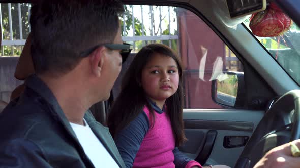 Indian Father and Daughter Talking in a Car