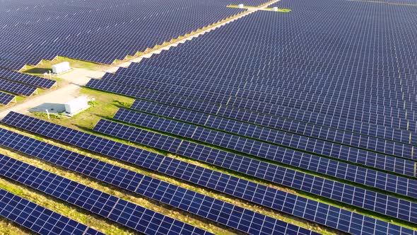 Aerial Drone View Flight Over Solar Power Station Panels alt