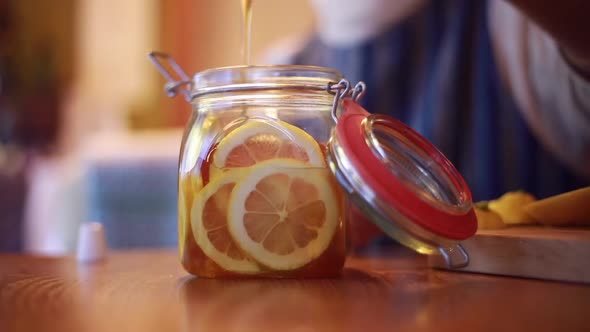 Woman making honey pickled lemon alt
