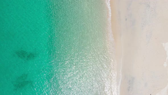 Aerial view of drone. Scene of top view beach and crystal seawater on sandy beach in summer. alt