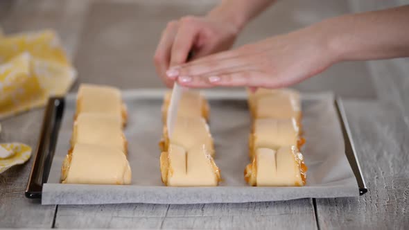 Raw Sweet Yeast Buns on a Baking Sheet Filling Buns Jam