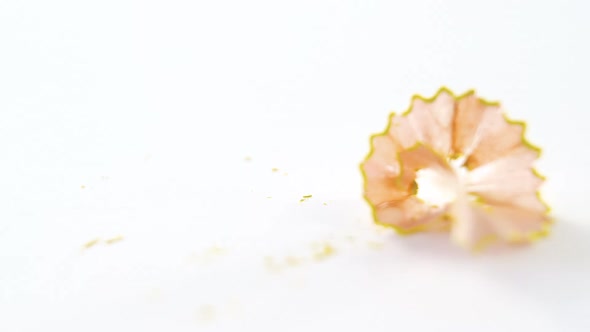 Yellow color pencil shavings on a white background alt