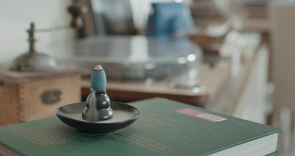 Timelapse of a Burning Incense Cone with White Fume Pouring Down like a Waterfall in Living Room for alt