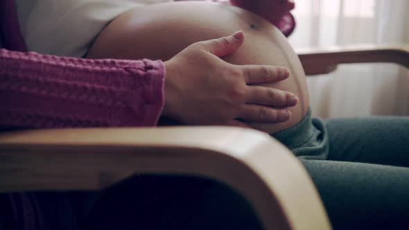 Happy Pregnant Woman and Expecting Baby at Home alt