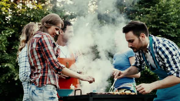 Friends Having a Barbecue Party in Nature