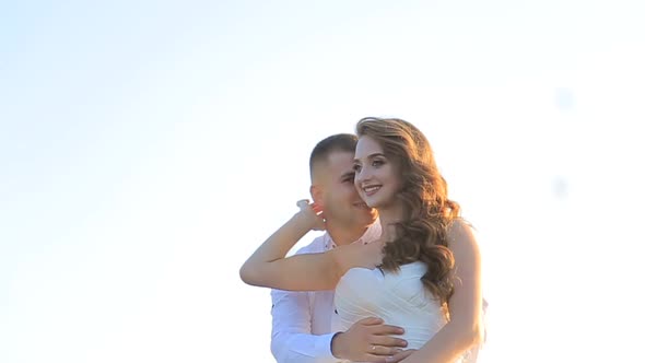 Close Up of Wedding Couple in Embraces Caresses in Embraces alt