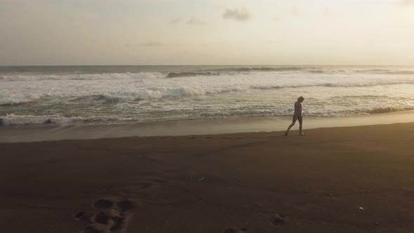 Girl Walking on the Beach alt
