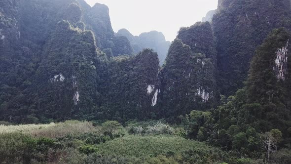 Flying to the Big Green Mountains During the Rain in Thailand