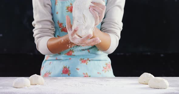 Woman kneading a dough 4k alt