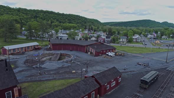 Aerial View of an Abandoned Narrow Gauge Coal Rail Road with Rusting Hoppers alt